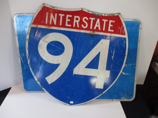 Interstate 94 Badge Sign and a Pair of Reflective Arrow Signs