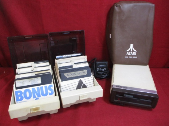 Atari 1050 Disc Drive w/ Two Boxes of Discs and Power Supply
