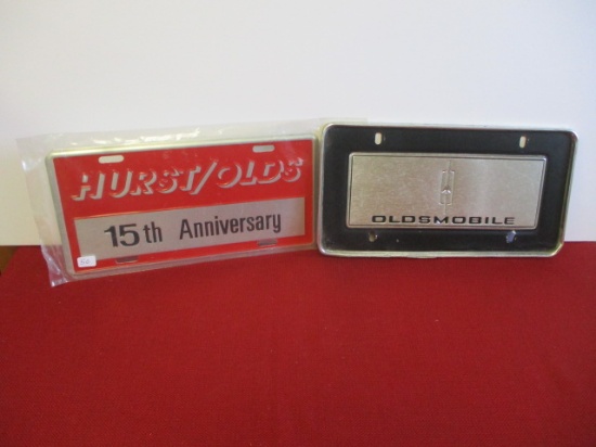 Pair of Oldsmobile Advertising License Plates