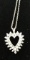 Ladies 14kt, w/g thirty-six diamond heart pendant