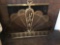 Brass fireplace surround and cherub motif fireplace screen