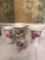 Lot of four rose pattern vases, etc