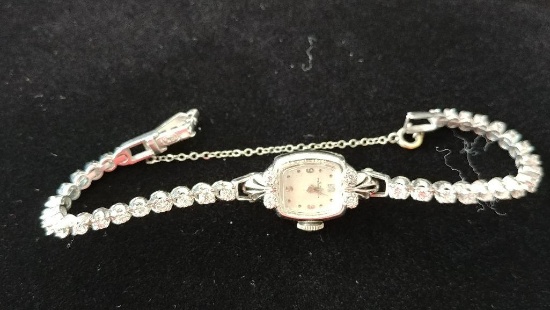 Ladies 14 kt, w/g four (4) diamond Girard Perregaux,