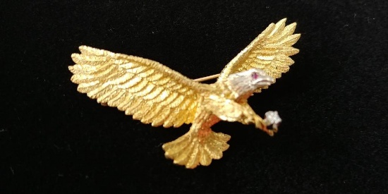 18 kt y/g eagle pin with two (2) ruby eyes. Total weight 13.38 gms