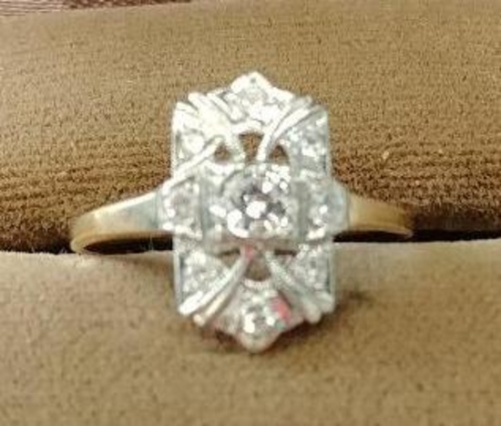 14kt, y/g nine (9) diamond dinner ring consisting of six (6) .03 single cut diamonds. Size 8 1/2.