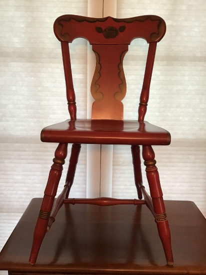 Ornate solid wood chair. Painted gold and red.