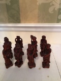 Eight wooden oriental figures Four inches tall