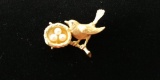 14 kt, y/g bird pin with ruby eyes, with nest of three (3) pearls