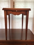 Small writing table with pull out door. Constitution decopauged on top of the table