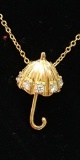 14 kt, y/g umbrella pendant with five (5) .05 diamonds and sixteen inch chain