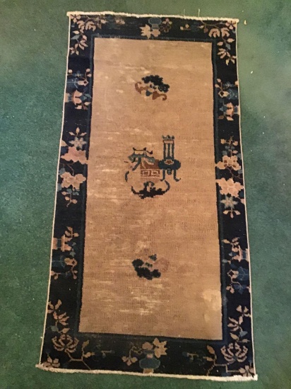 Old rug. 56 x 29 inches.