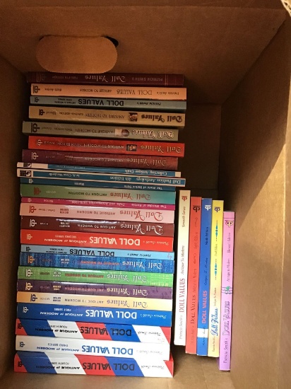 Box of collector doll value books