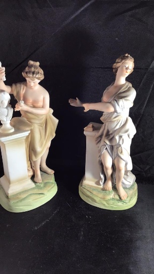 Pair of porcelain figurines.  8 inches.   Andre