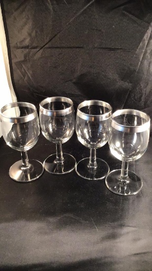 Four sherry glasses, silver trimmed