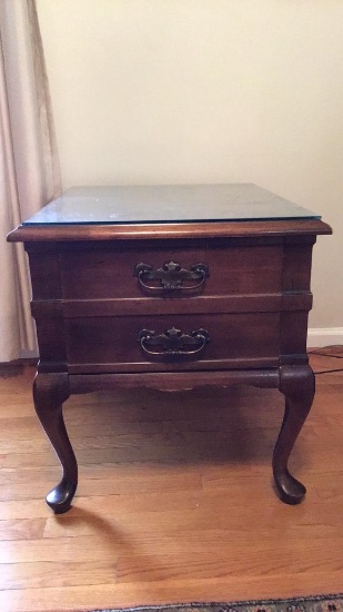 Walnut finish end table.  Top measures 21 x 27