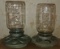 Two chicken feeders, galvanized base.  Ball jar tops