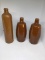 Lot three crock bottles.  11 inch salt glazed,