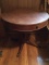 Mahogany drum top table, brass feet.  30 inch