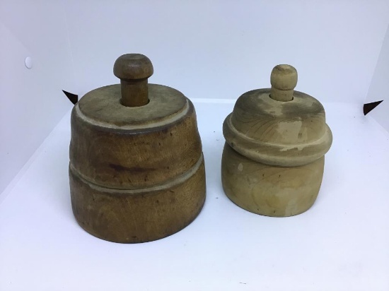 Two wooden butter presses.