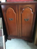 Mahogany finish two door cabinet.  39 inches