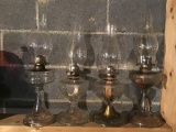 Four oil lamps.  Two Greek key,