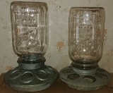 Two chicken feeders, galvanized base.  Ball jar tops