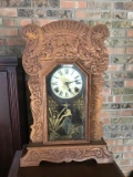 Oak mantle clock.  Pendulum and key.  22 inches