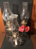 Three oil lamps. 15 and 18 inches