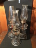 Three oil lamps. 16 and 18 inches
