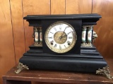 Antique mantle clock.  Cherub motif on columns.