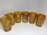 Six carnival glass four inch glasses.