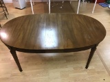 70 inch oval dining table.  Leaf removes to make