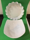 Lot of white serving dishes.  Small rectangular