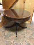 Glass top mahogany drum table with four drawers