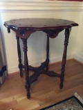 Dark mahogany end table. Round 29 inches tall