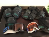 Ski goggles, knee pads