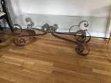 Glass and metal coffee table.  58 inches long.