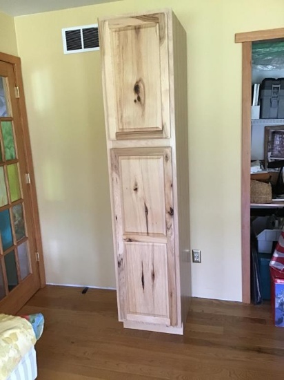 Light pine finish cabinet.