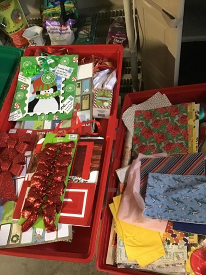 2 boxes with holiday items and wrapping.