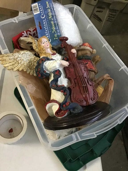 Box with Christmas ornaments and angel statue