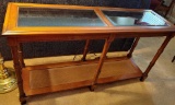 Glass and rattan. 52 inch sofa table