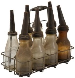 Lot Of 8 Oil Bottles In Rack