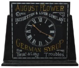 August Flower German Syrup Reverse Painted Clock in Stand