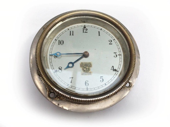 A Smiths silver faced eight day car clock.