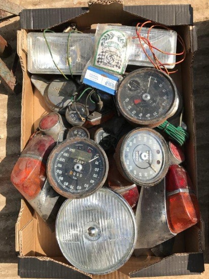 A box of Jaguar Mk. II parts to include rear lights, instruments etc.