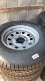 1 of 4 new tires 225/75 r15 w/rim
