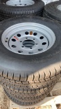4 of 4 new tires 225/75 r15 w/rim