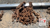 Pieces of chain, broken binder, railroad spikes