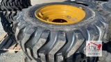 (4) 12-16.5 Skidsteer Tires on NH/JD/CAT Wheels