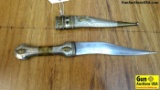 Dagger Knife. Very Good. A Very Ornate Dagger in a Semi Serpentine Style. 7 Inch Blade, Metal Handle